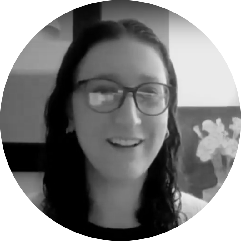 A circular photo of Amy Back in black and white